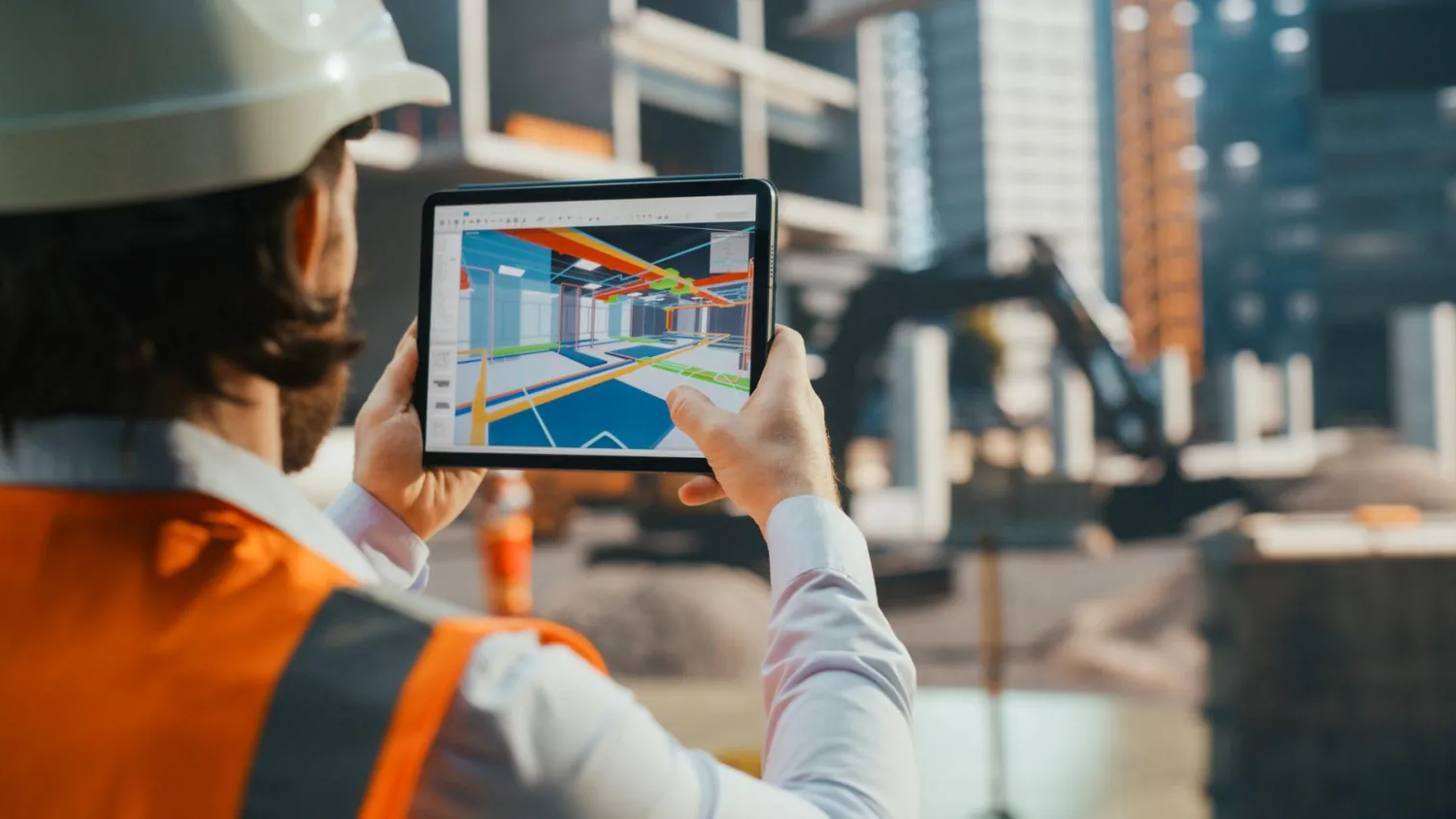 Engineer reviewing a 3D model in AI construction management software on site
